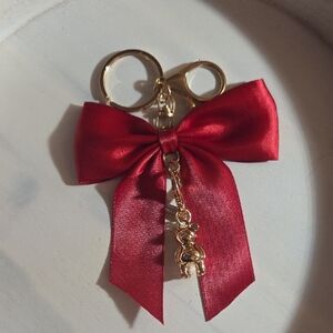 Elegant Red Bow Keychain with Coach Bear Gold Accents
